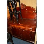 A VICTORIAN FLAME MAHOGANY CHIFFONIER with a raised carved foliate back above a single long drawer