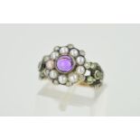AN AMETHYST, SPLIT PEARL AND DIAMOND RING, designed as a central circular amethyst cabochon within a