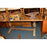 A LARGE OAK REFECTORY TABLE on bulbous legs united by a stretcher, width 181cm x depth 75cm x height