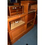 A LIGHT OAK THREE SECTION BOOKCASE, two sections with glazed fall front doors, width 80cm x depth