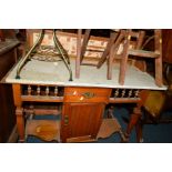 AN EDWARDIAN ASH MARBLE TOPPED WASHSTAND with a tile back (losses)