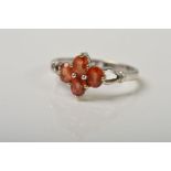 A 9CT WHITE GOLD GEM RING, designed as a quatrefoil of oval orange gems, assessed as sapphire within