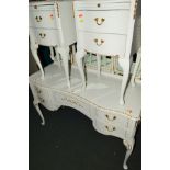A CREAM AND GILT DRESSING TABLE with a triple mirror, five drawers, a pair of two drawer bedside