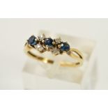 A SAPPHIRE AND DIAMOND RING, designed as three circular sapphires each interspaced by two single cut