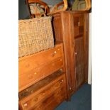 AN OAK SINGLE DOOR WARDROBE, together with an oak dressing chest and a matching chest of three