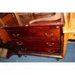 A MAHOGANY CHEST OF THREE LONG DRAWERS together with a coffee table (2)