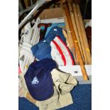 A BOX AND LOOSE CLOTHES, CRICKET STUMPS, PADS ETC, to include 'Police' jeans and trousers, walking