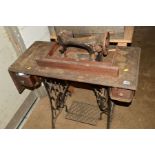 A DISTRESSED VICTORIAN SINGER TREADLE SEWING MACHINE