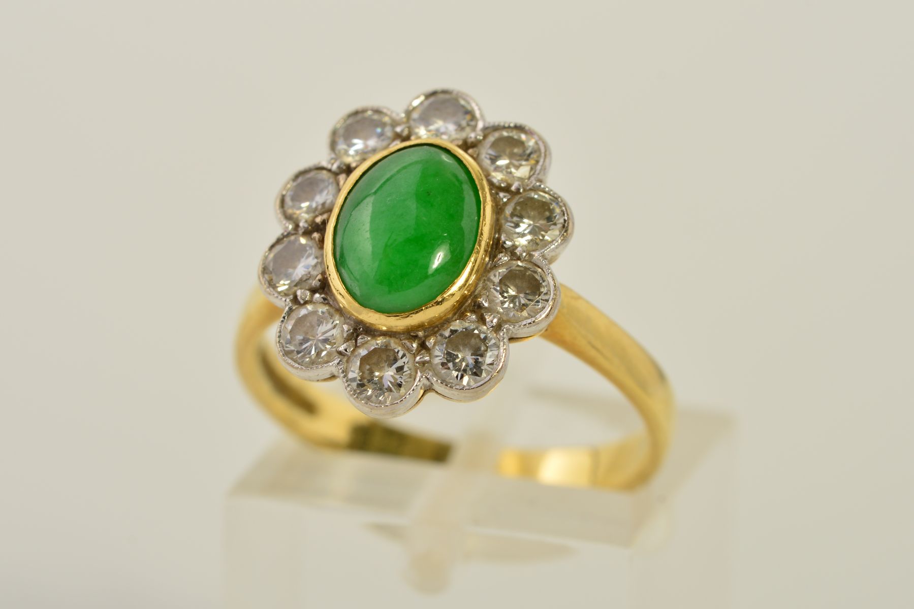 AN 18CT GOLD JADE AND DIAMOND CLUSTER RING, designed as a central oval jade cabochon within a collet - Image 3 of 3