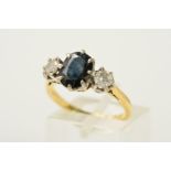 A SAPPHIRE AND DIAMOND RING, designed as a central oval sapphire with a brilliant cut diamond claw