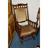 AN EDWARDIAN MAHOGANY AMERICAN ROCKING CHAIR