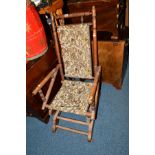 AN EDWARDIAN MAHOGANY AMERICAN ROCKING CHAIR, together with an oak fireside chair and kitchen