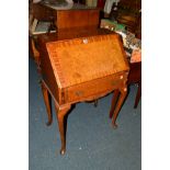 A REPRODUCTION WALNUT AND MAHOGANY LADIES FALL FRONT BUREAU with a single drawer, on cabriole legs