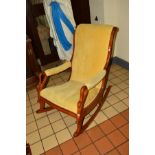 A REPRODUCTION MAHOGANY ROCKING CHAIR, with swan neck armrests