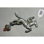 A CHROME PLATED CAR MASCOT, shaped as horse and jockey jumping a fence, marked 'Copyright'