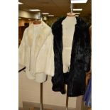 A LADIES SHORT WHITE CONEY FUR JACKET, together with a ladies 3/4 black Coney fur coat (2)
