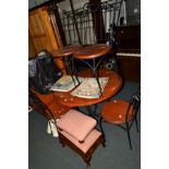 A CIRCULAR HARDWOOD DINING TABLE on a wrought iron base, together with four matching chairs (5)