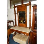 AN EARLY 20TH CENTURY GOLDEN OAK HALL STAND, with central mirror and various turned hooks, above a