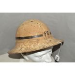 A WWII ERA BRODIE STYLE STEEL HELMET, painted in cream colour, with initials 'F.G', along with black
