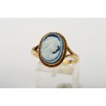 A 9CT GOLD CAMEO RING, the oval glass cameo depicting a lady in profile within a rope twist surround