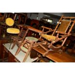 AN EDWARDIAN MAHOGANY CHILD'S AMERICAN ROCKING CHAIR, together with a folding oak child's chair,