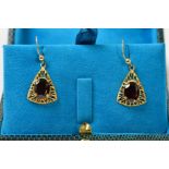 A PAIR OF 9CT GOLD GARNET DROP EARRINGS, each designed as an oval garnet within an openwork,