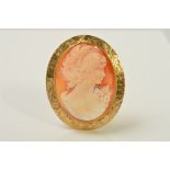 A 9CT GOLD CAMEO BROOCH, of oval outline, carved to depict a lady in profile to the rope twist