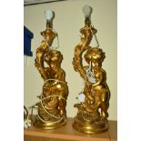 A PAIR OF LARGE PLASTER TABLE LAMPS, shaped as Cherubs with gilt finish height approximately 70cm (