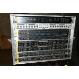 A THON 8 UNIT FLIGHTCASED RACK, containing two Behringer CX2310 2/3 way Active Crossovers, a