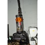 A DYSON DC14 UPRIGHT VACUUM CLEANER together with a Janome sewing machine (2)