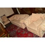 AN UPHOLSTERED CHESTERFIELD TWO PIECE LOUNGE SUITE, comprising a three seater settee and armchair,