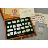 A WOODEN CASED SET OF LIMITED EDITION SILVER REPLICAS OF 'THE STAMPS OF ROYALTY', comprising