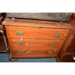 AN EDWARDIAN SATINWOOD CHEST OF THREE DRAWERS and a pine open bookcase (2)