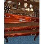 A MODERN MAHOGANY FINISH THREE DRAWER CHEST ON CABRIOLE LEGS, the top drawer fitted with a silver
