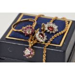 A 9CT GOLD RUBY AND DIAMOND SMALL CLUSTER PENDANT AND FINE CHAIN, measuring approximately 420mm in