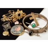 A SELECTION OF JEWELLERY, to include a hinged silver bangle, a small circular rolled gold locket,