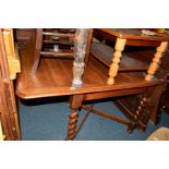 AN EARLY 20TH CENTURY OAK BARLEY TWIST DROP LEAF DINING TABLE on a cross stretchered base, 92cm