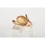 A 9CT GOLD CLOGAU OPAL AND DIAMOND RING, designed as an oval jelly opal cabochon within an