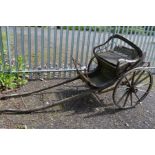 A 19TH CENTURY WOODEN TWIN WHEELED HORSE DRAWN TRAP, diameter of wheels 90cm, width 122cm (sd)