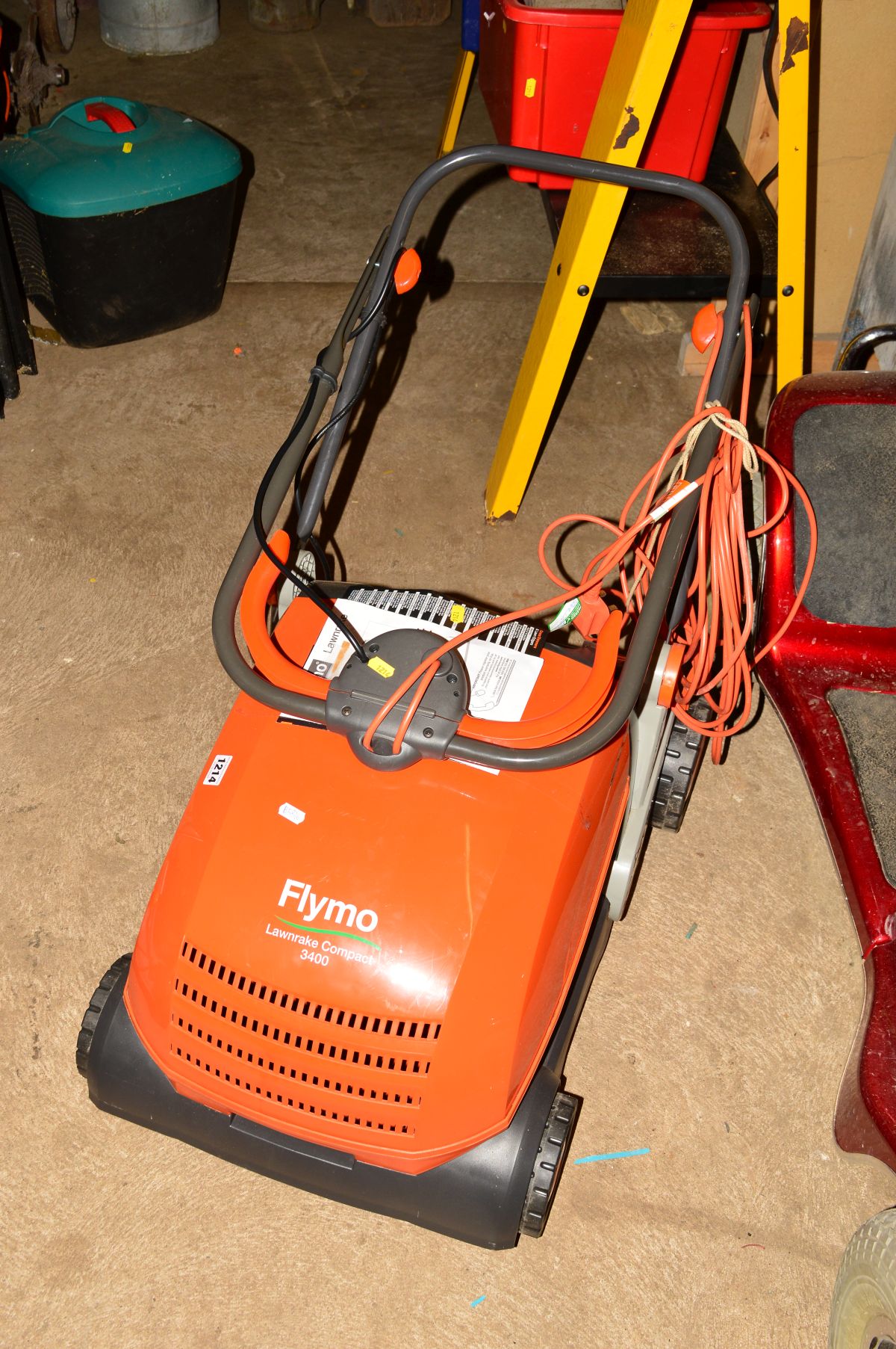 A FLYMO COMPACT 3400 ELECTRIC LAWN RAKE