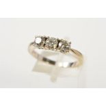 AN 18CT GOLD THREE STONE DIAMOND RING, designed as three brilliant cut diamonds, each within a