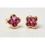 A PAIR OF 9CT GOLD RUBY STUD EARRINGS, each designed as four circular rubies in a quatrefoil shape