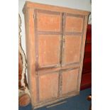 A DISTRESSED 19TH CENTURY PAINTED PINE PANELLED FOUR DOOR HOUSEKEEPERS CUPBOARD, width 129cm x depth