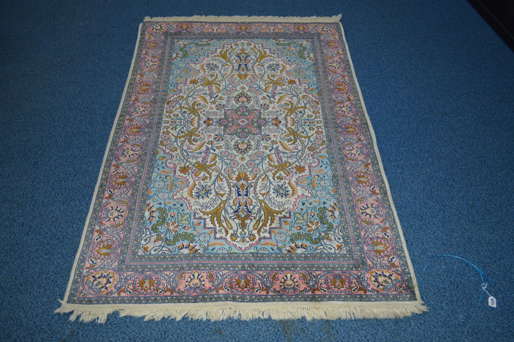 A LATE 20TH CENTURY AXMINSTER SILK RUG, light blue ground, approximately 185cm x 125cm (showing