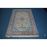 A LATE 20TH CENTURY AXMINSTER SILK RUG, light blue ground, approximately 185cm x 125cm (showing