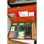 A CASED GAMES COMPENDIUM, to include chess, backgammon, bridge, card games, dominoes, etc