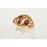 A 9CT GOLD SNAKE RING, designed as two interlocking snake heads one set with an oval garnet, the