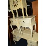 A CREAM PAINTED DRESSING TABLE WITH FOUR DRAWERS, together with a matching pair of bedside chests