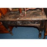 AN EARLY 20TH CENTURY OAK HALL TABLE, single carved door with a lions head handle, on turned legs,