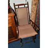 AN EDWARDIAN MAHOGANY AMERICAN ROCKING CHAIR